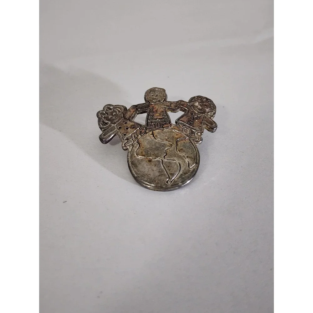 Vintage Silver Tone Children Holding Hands World Globe Brooch Pendant MJ Logo